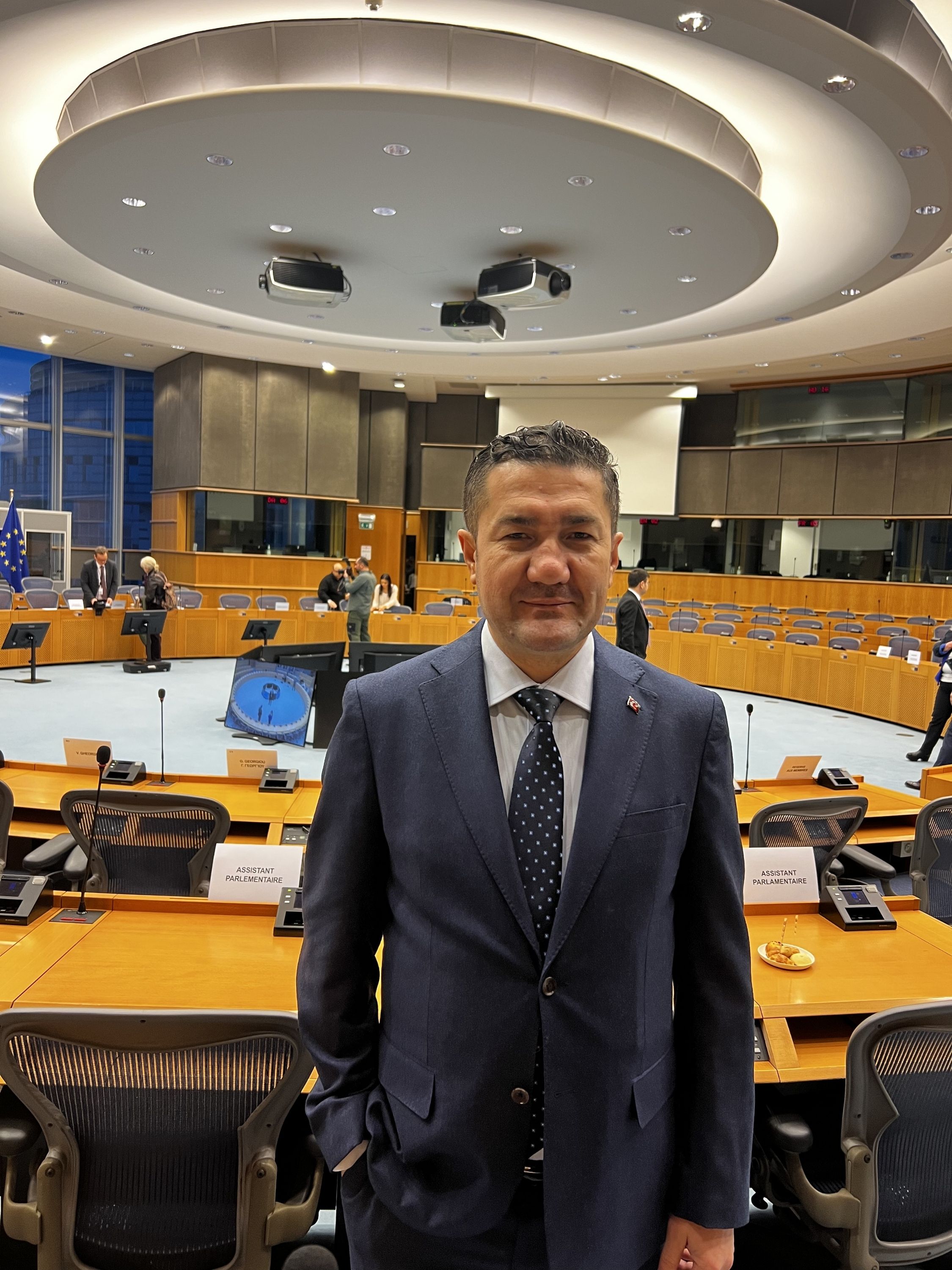 Murat Kınacı in an international meeting room